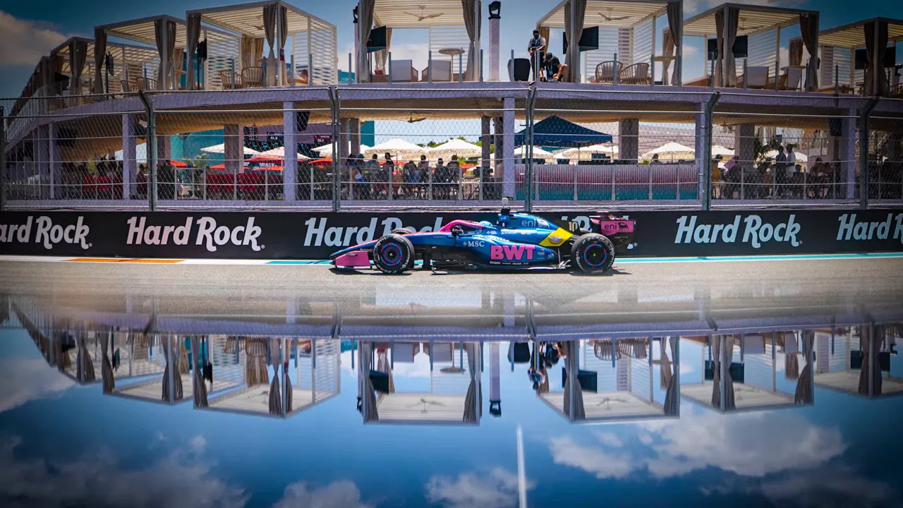Mercedes F1 car on the track with a mirrored reflection effect on the water surface at the Miami GP