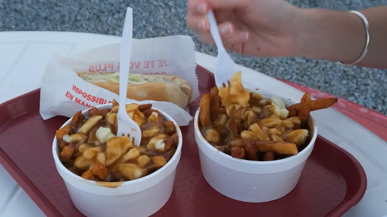 Poutine and poutine toppings at a Canadian Grand Prix food tray