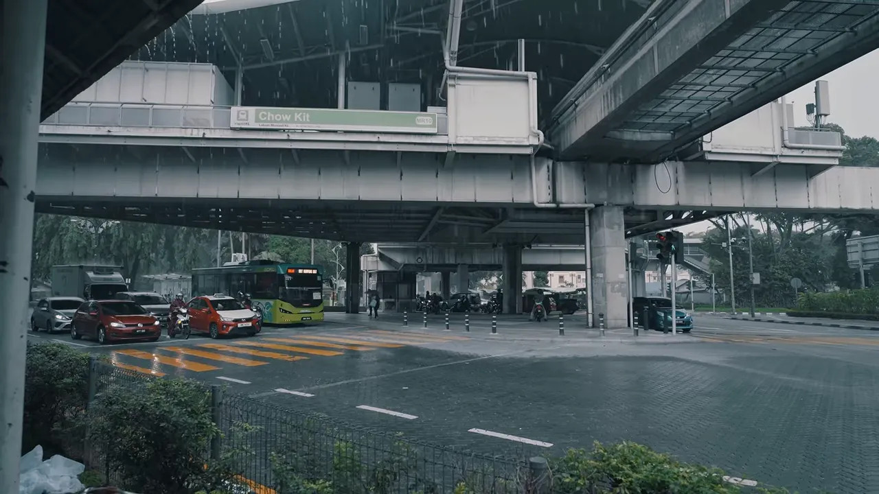 Heavy rain falling beneath elevated roadways in Malaysia