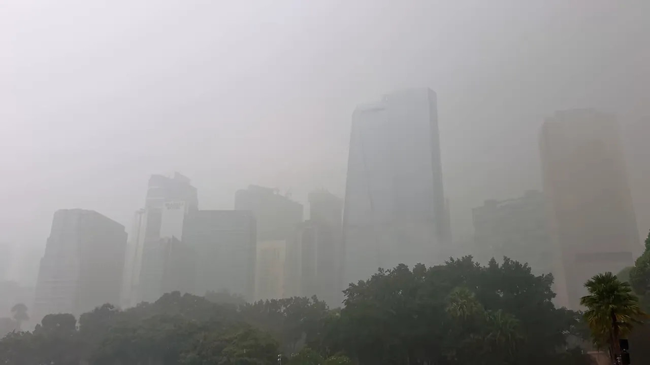 Kuala Lumpur skyline largely obscured by thick haze