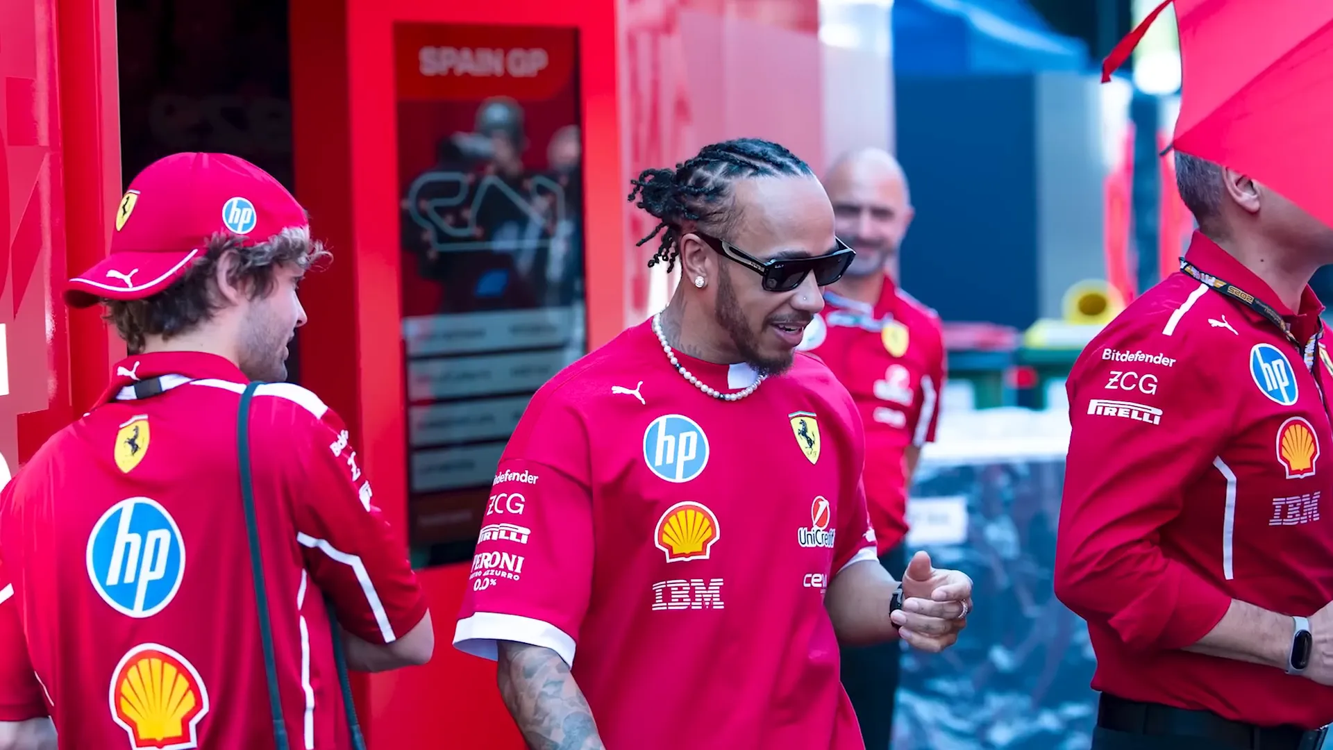 Lewis Hamilton running down pit lane on media day
