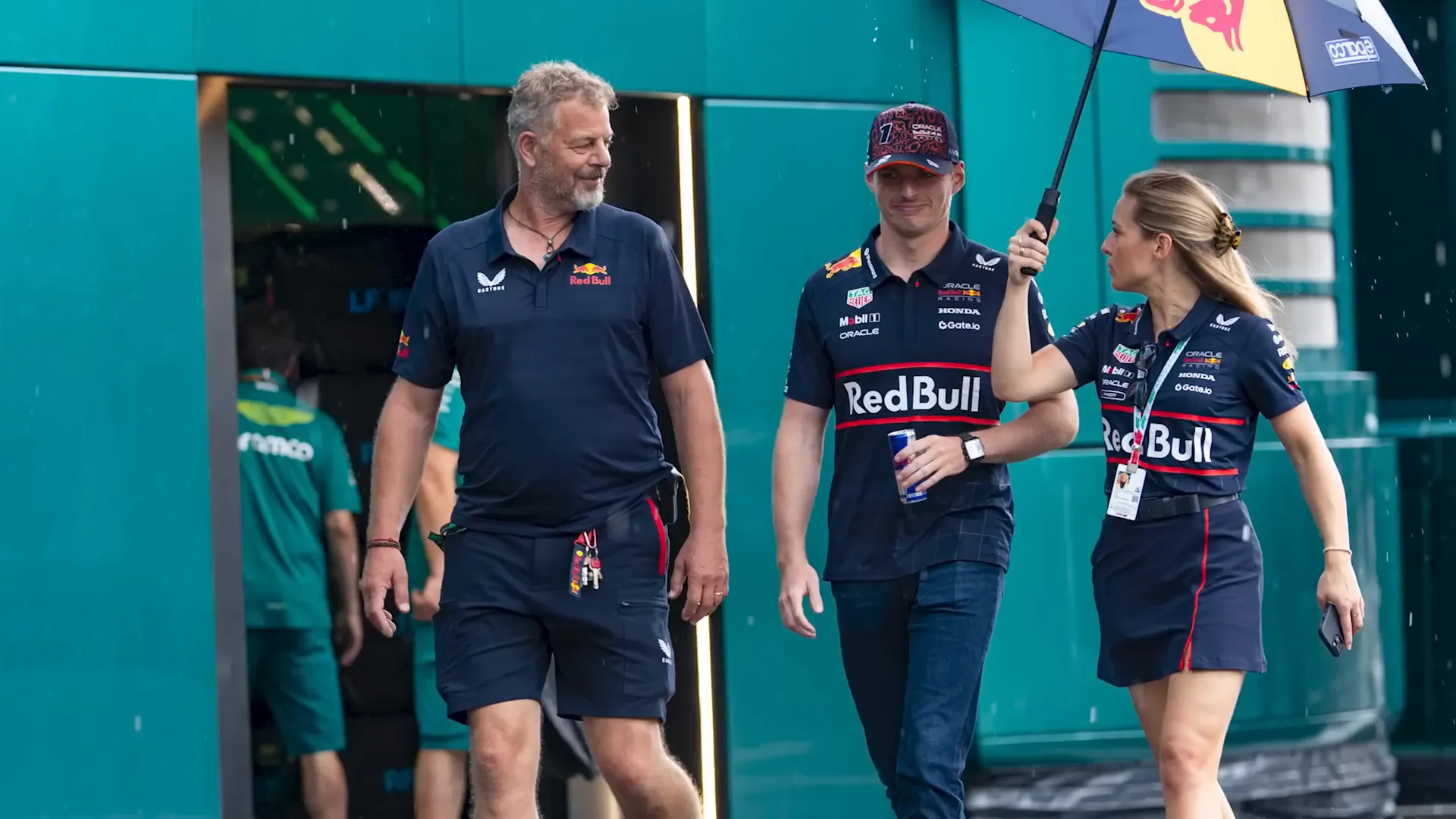 Max Verstappen smiling despite rainy conditions after press conference