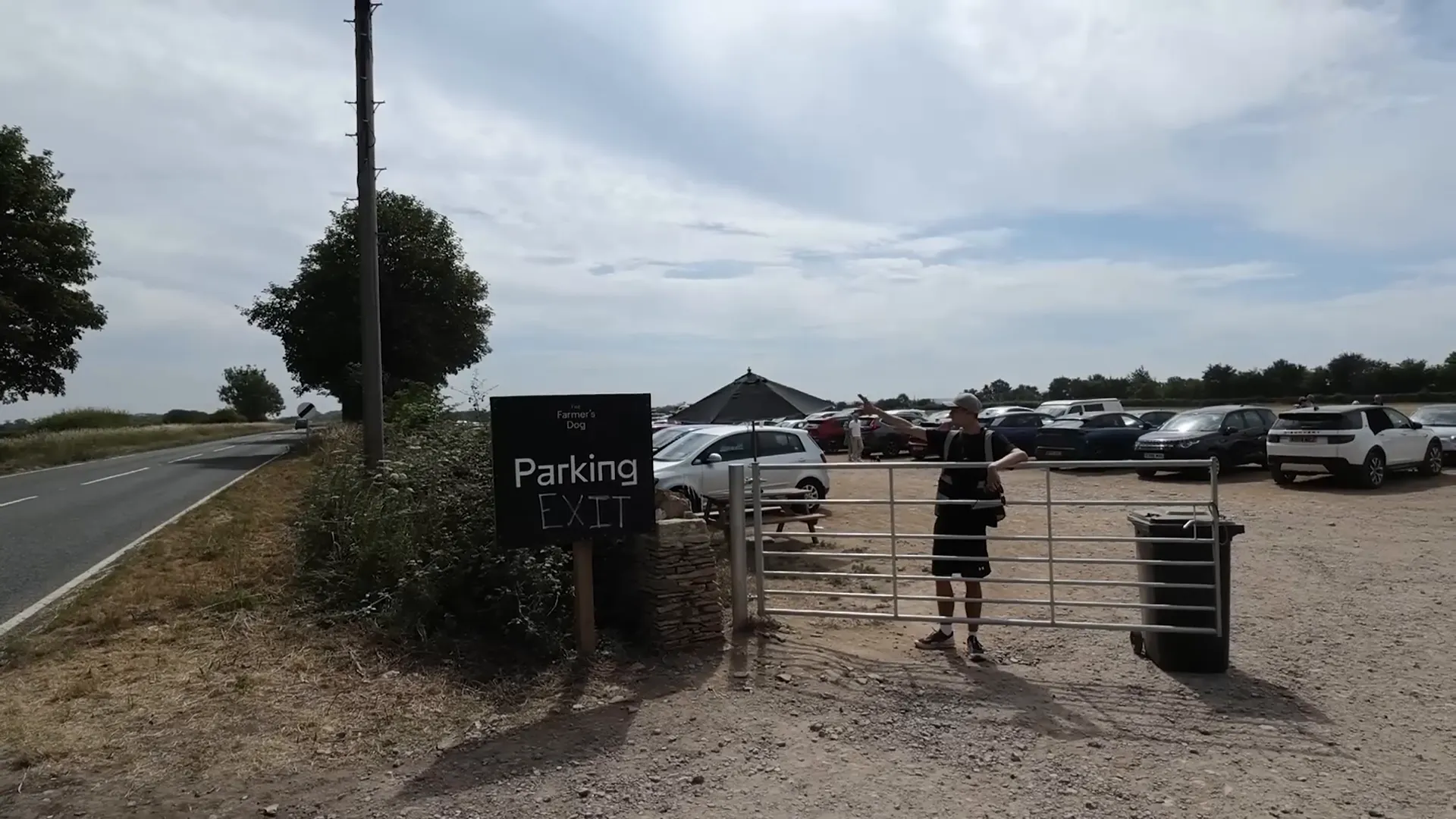 Overflow car park with hundred-year-old trees shading cars at Jeremy Clarkson's pub