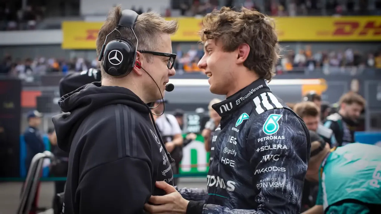 Antonelli talking with a team member during the Japan Grand Prix in the pit lane