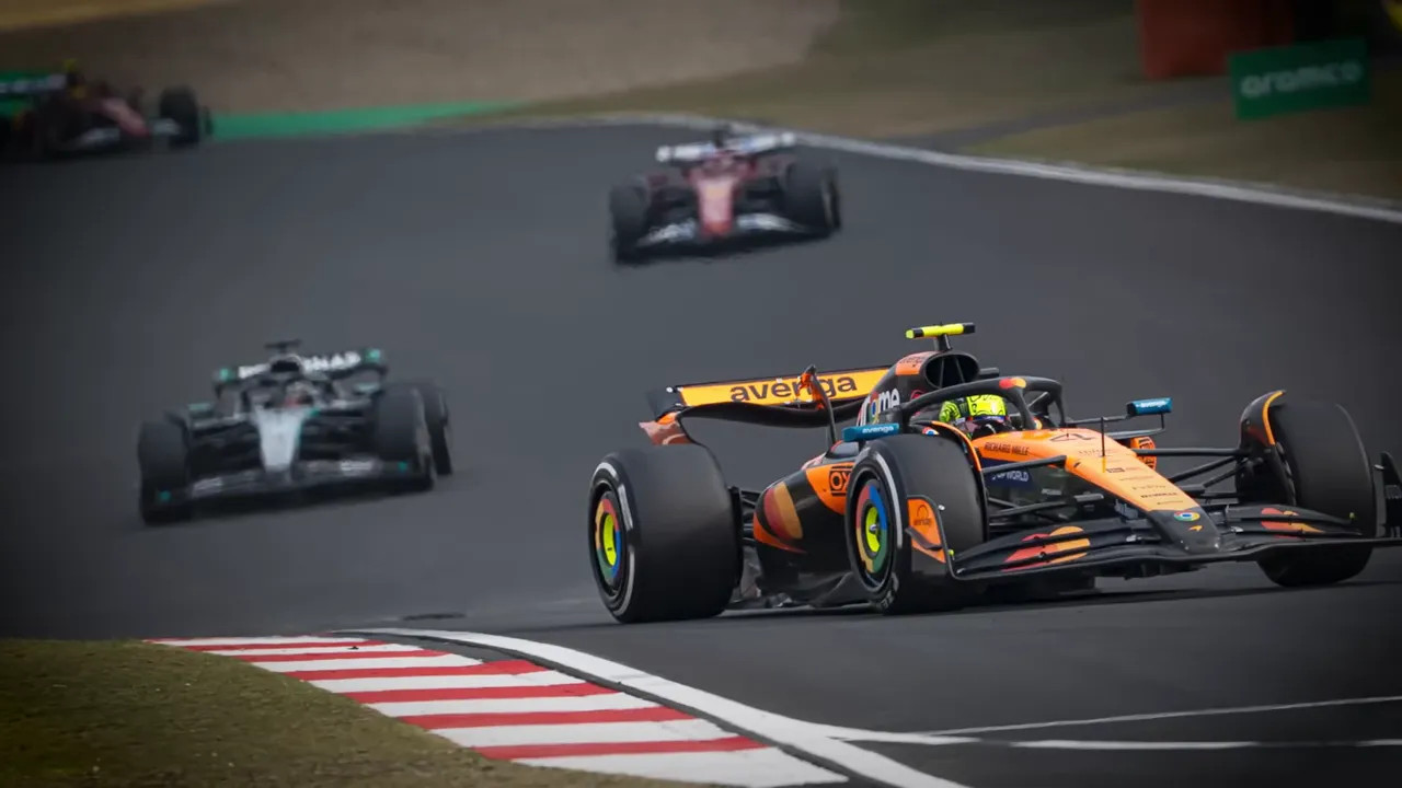 F1 cars racing on track during the Japanese Grand Prix with Kimi Antonelli's car in view