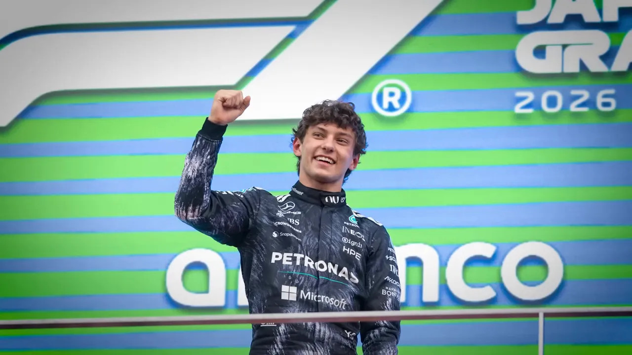 Kimi Antonelli raises his fist during a podium celebration in Japan in 2026