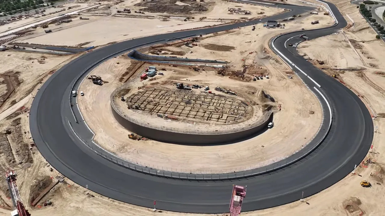 Aerial view of the large banked Monumental corner with fresh black tarmac