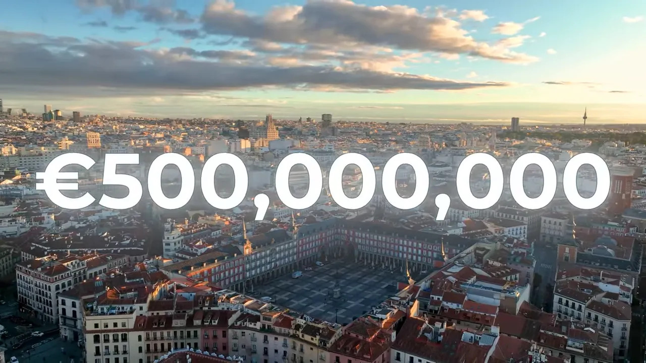 Madrid city skyline with large text showing 500,000,000 euros