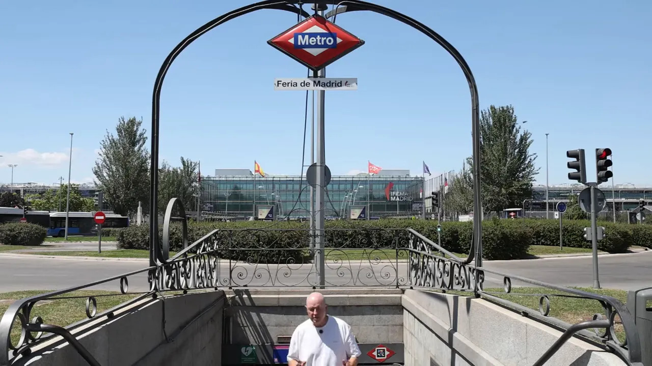 Metro entrance sign for Feria de Madrid with IFEMA buildings in the background