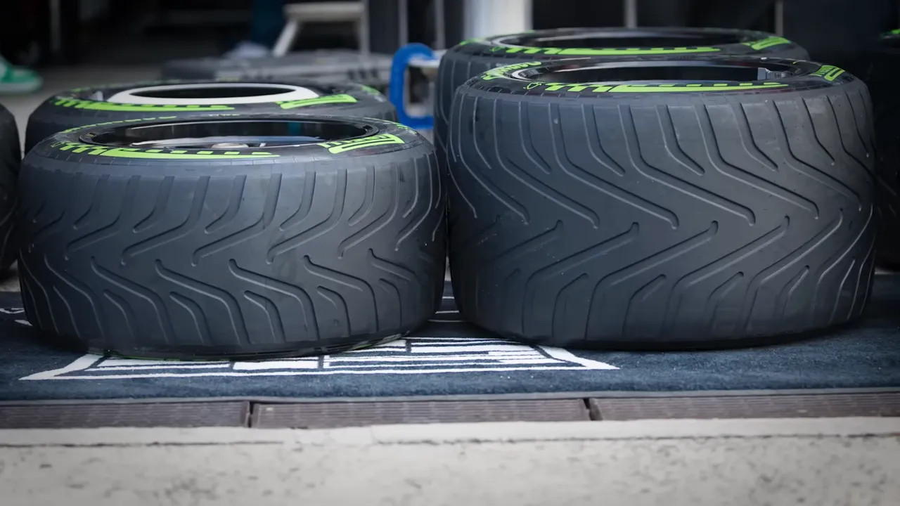 Intermedaite wet tyres laid out on a grid for Formula 1 conditions